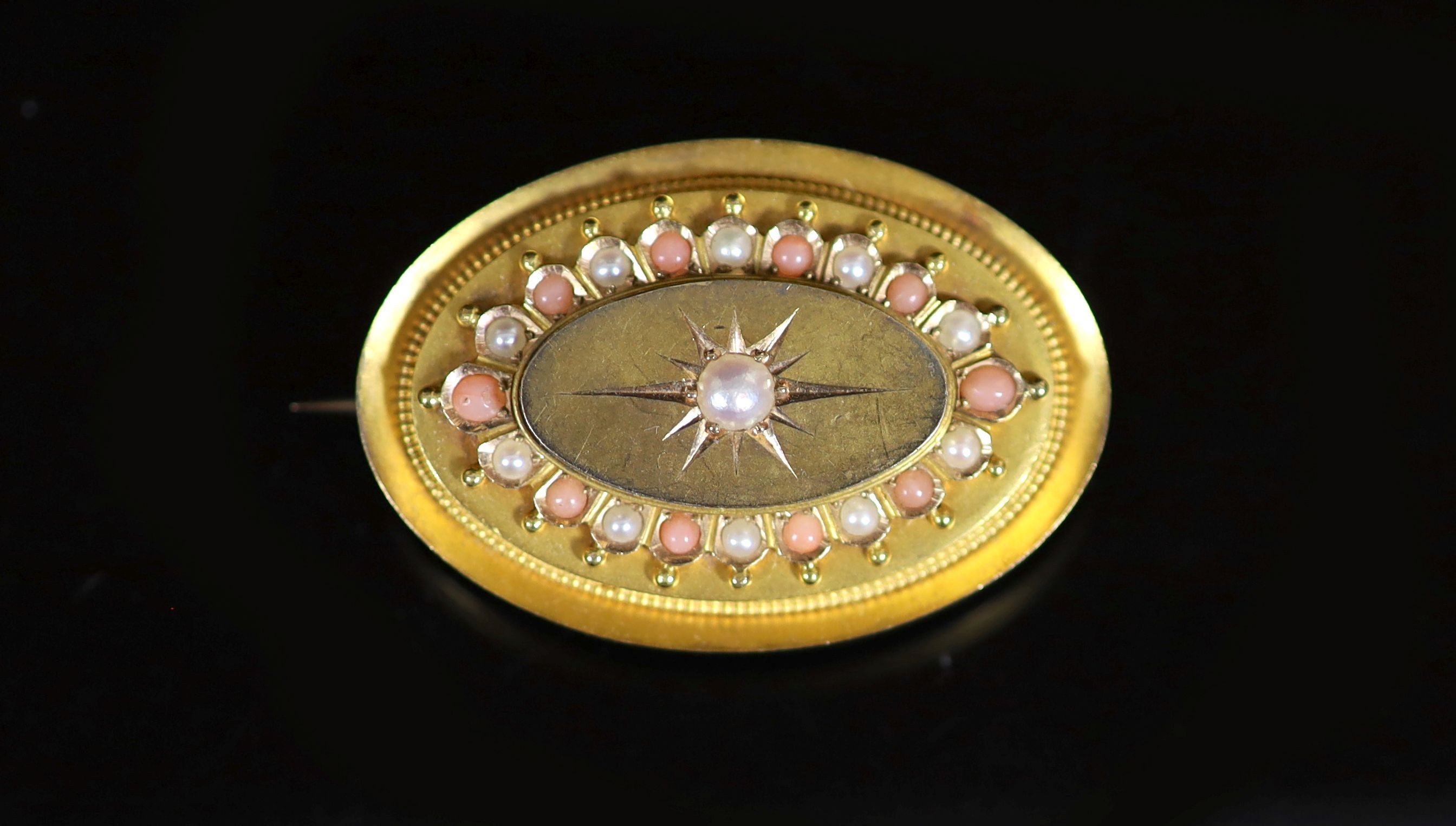 A Victorian gold, split coral and split pearl set oval brooch